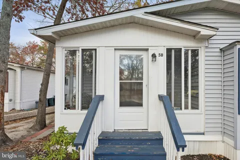 a front view of a house with a glass door