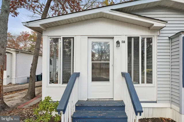 a front view of a house with a glass door