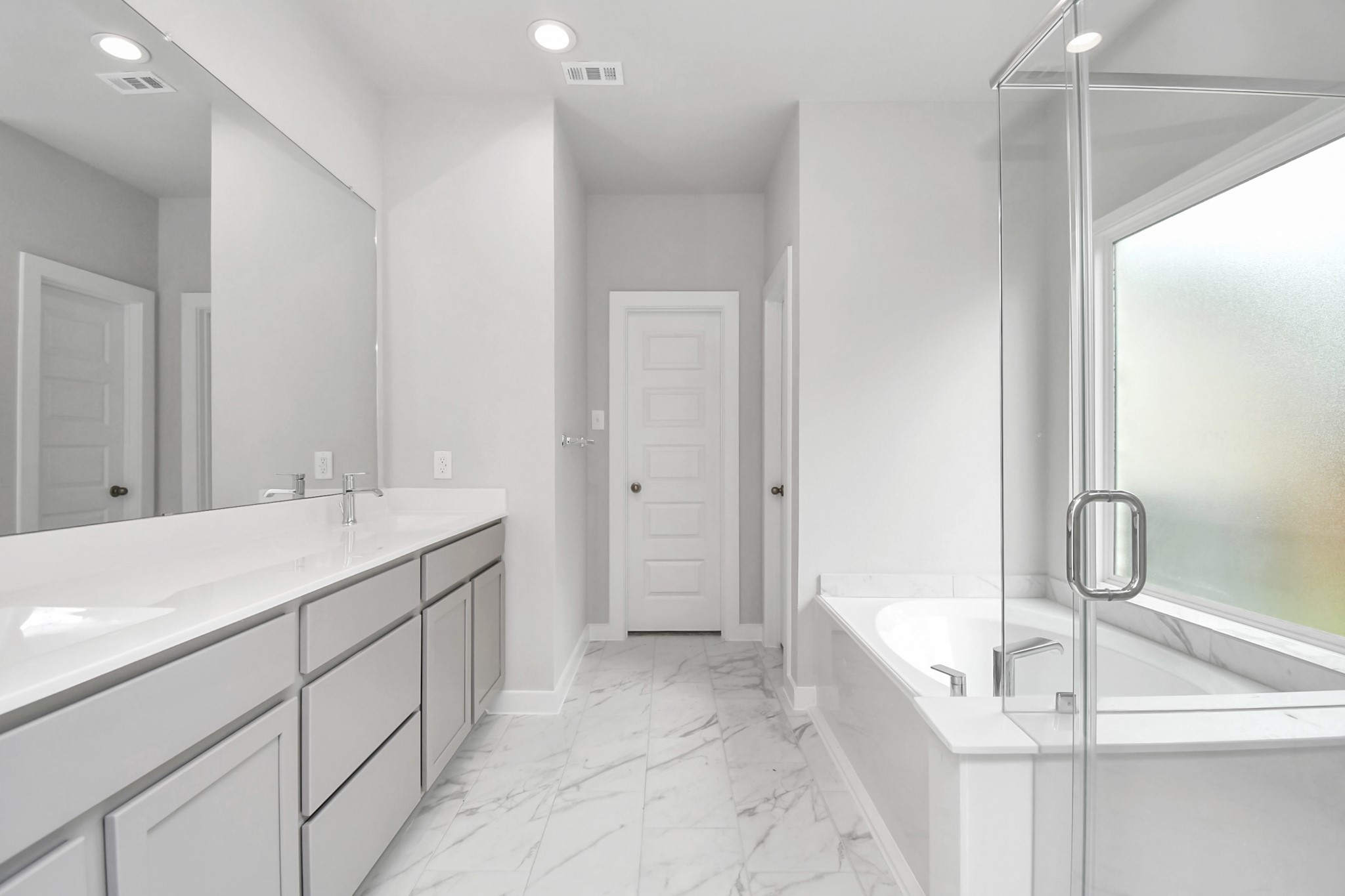 11106 Crocus Drive Houston, TX 77044 - Photo 29 of 40 a bathroom with a double vanity sink mirror and bathtub