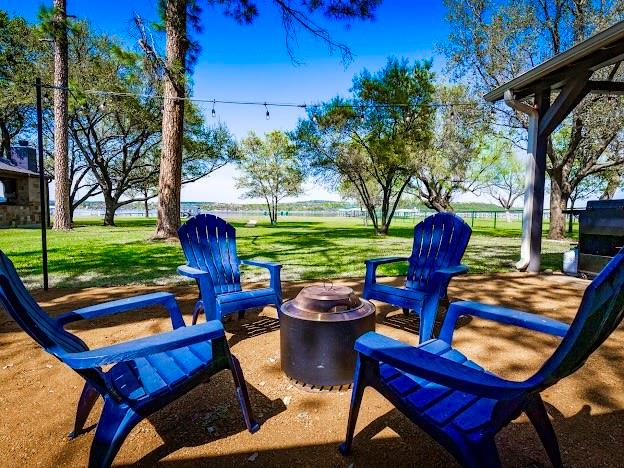 1957 Deer Trail Road Graford, TX 76449 - Photo 9 of 32 a backyard of a house with outdoor seating