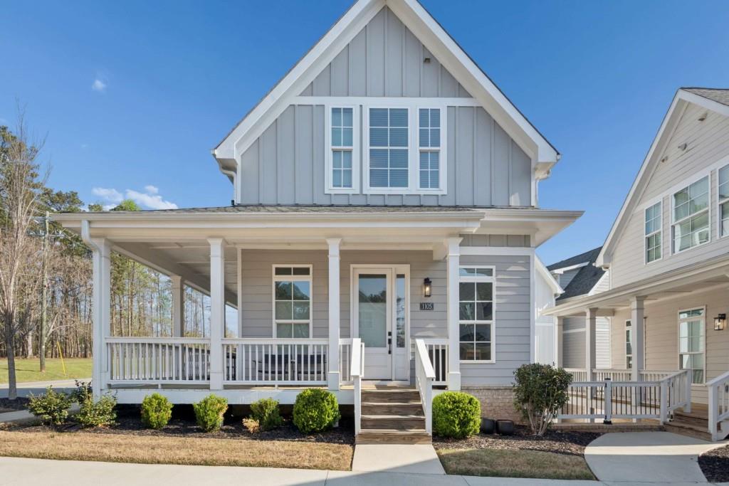 1105 Adam Circle Roswell, GA 30076 - Photo 1 of 34 a front view of a house with garden