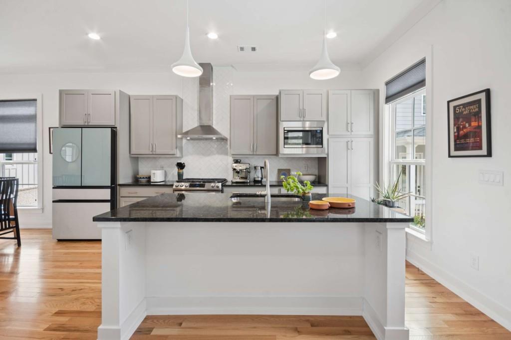 1105 Adam Circle Roswell, GA 30076 - Photo 2 of 34 a kitchen with stainless steel appliances granite countertop a sink and a refrigerator