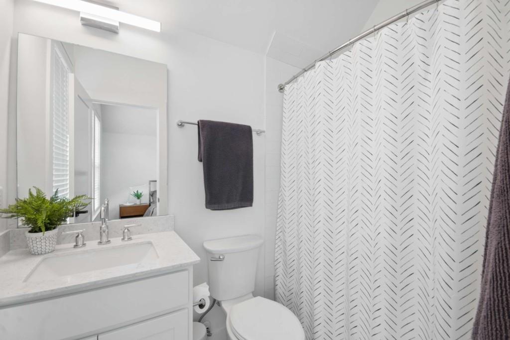 1105 Adam Circle Roswell, GA 30076 - Photo 26 of 34 a bathroom with a sink toilet and mirror