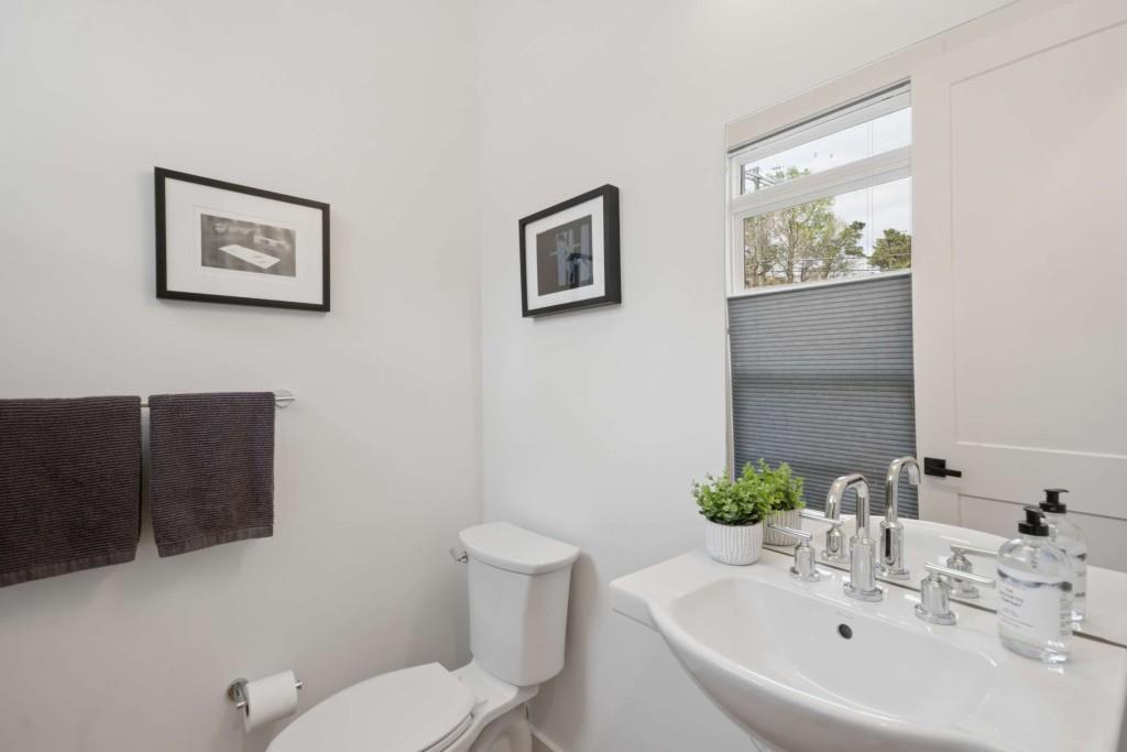 1105 Adam Circle Roswell, GA 30076 - Photo 28 of 34 a bathroom with a toilet a sink and mirror