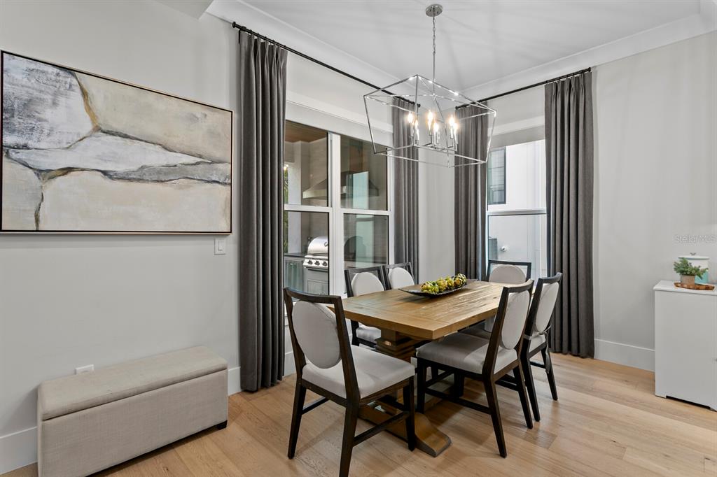 4807 West San Rafael Street Tampa, FL 33629 - Photo 13 of 64 a view of a dining room with furniture window and wooden floor