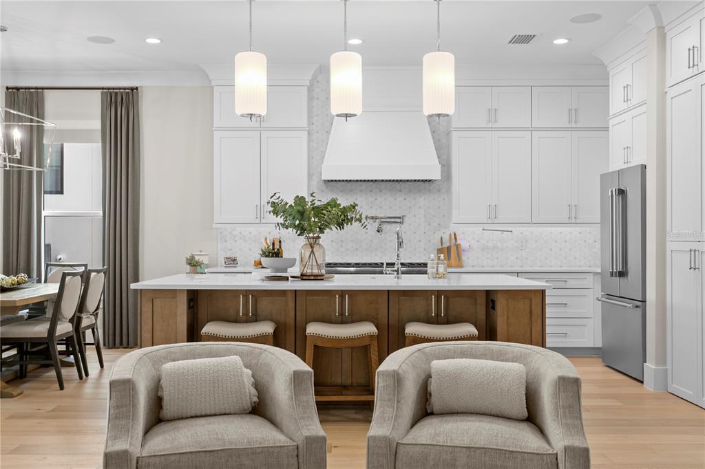 4807 West San Rafael Street Tampa, FL 33629 - Photo 14 of 64 a living room with furniture kitchen view and a large mirror