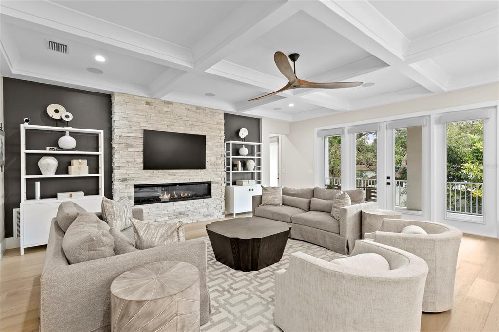 4807 West San Rafael Street Tampa, FL 33629 - Photo 17 of 64 a living room with furniture and a flat screen tv
