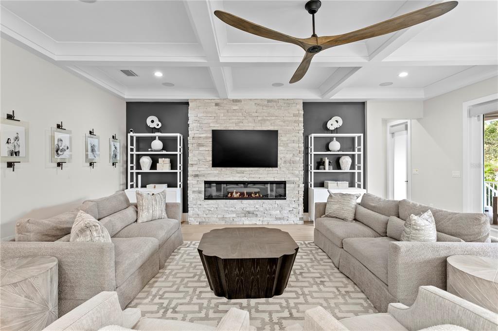 4807 West San Rafael Street Tampa, FL 33629 - Photo 18 of 64 a living room with furniture and a flat screen tv