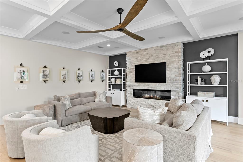 4807 West San Rafael Street Tampa, FL 33629 - Photo 19 of 64 a living room with furniture and a flat screen tv