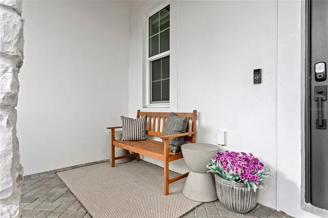 a room with furniture and flowers