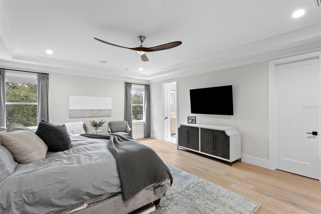 4807 West San Rafael Street Tampa, FL 33629 - Photo 22 of 64 a bedroom with a bed and a flat screen tv