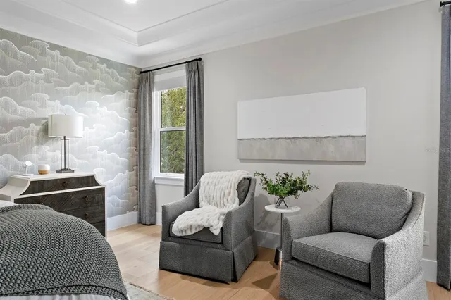 a spacious bathroom with a double vanity sink a mirror and a bathtub
