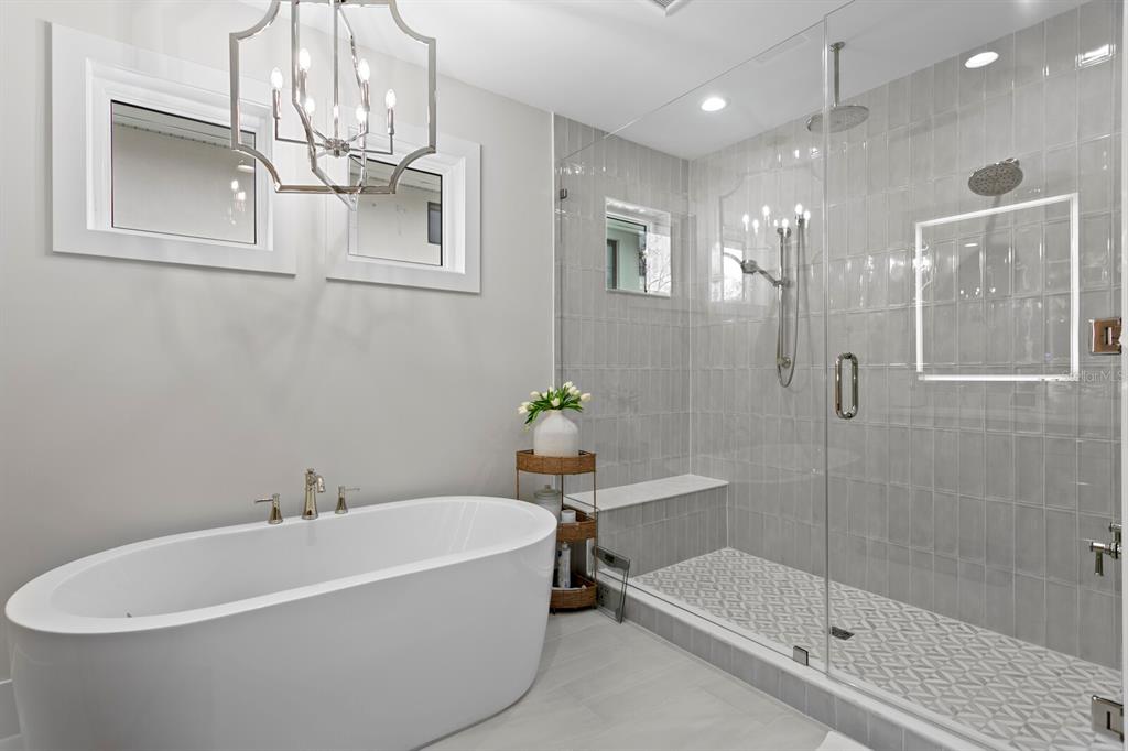 4807 West San Rafael Street Tampa, FL 33629 - Photo 24 of 64 a white bath tub sitting next to a bathroom