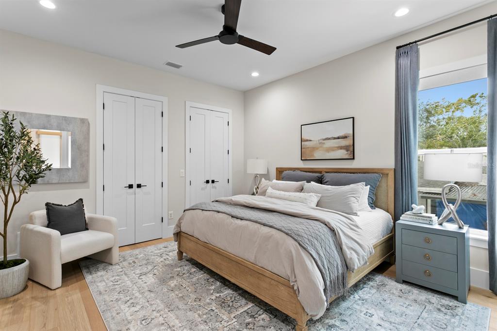 4807 West San Rafael Street Tampa, FL 33629 - Photo 27 of 64 a bedroom with a bed and a couch