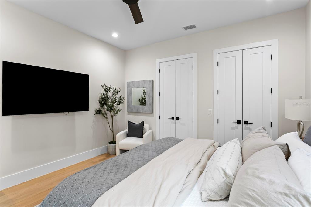 4807 West San Rafael Street Tampa, FL 33629 - Photo 28 of 64 a bedroom with a bed and a flat screen tv