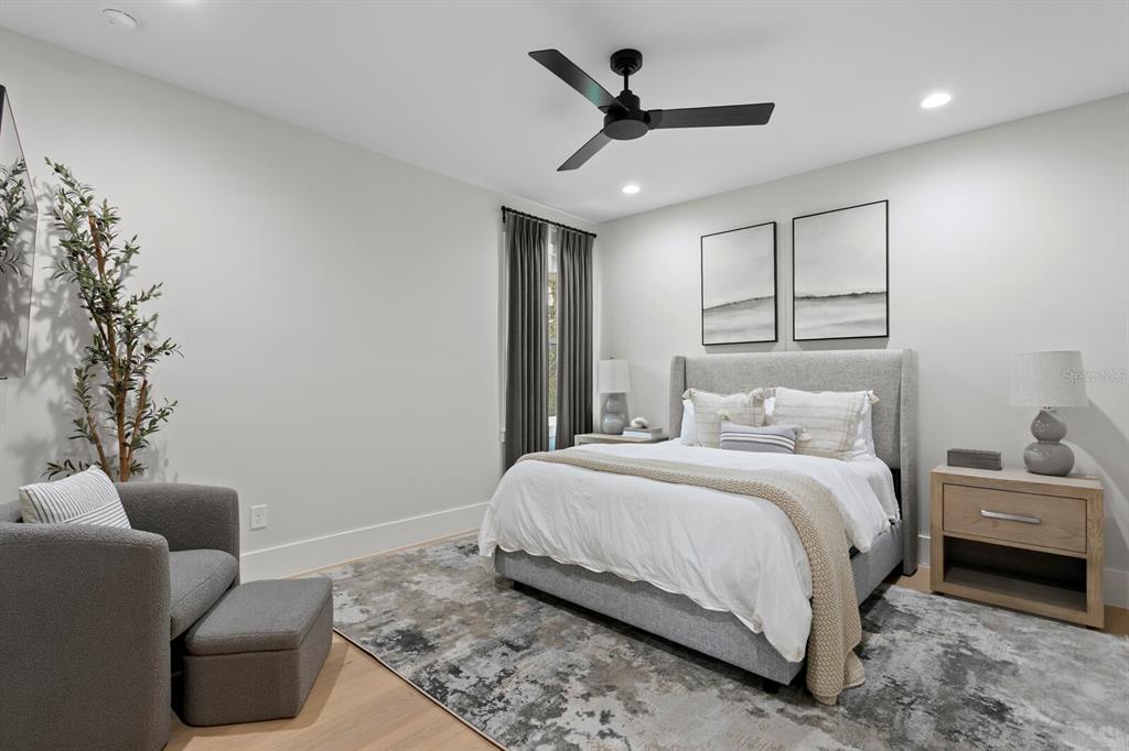 4807 West San Rafael Street Tampa, FL 33629 - Photo 30 of 64 a bedroom with a bed and a couch