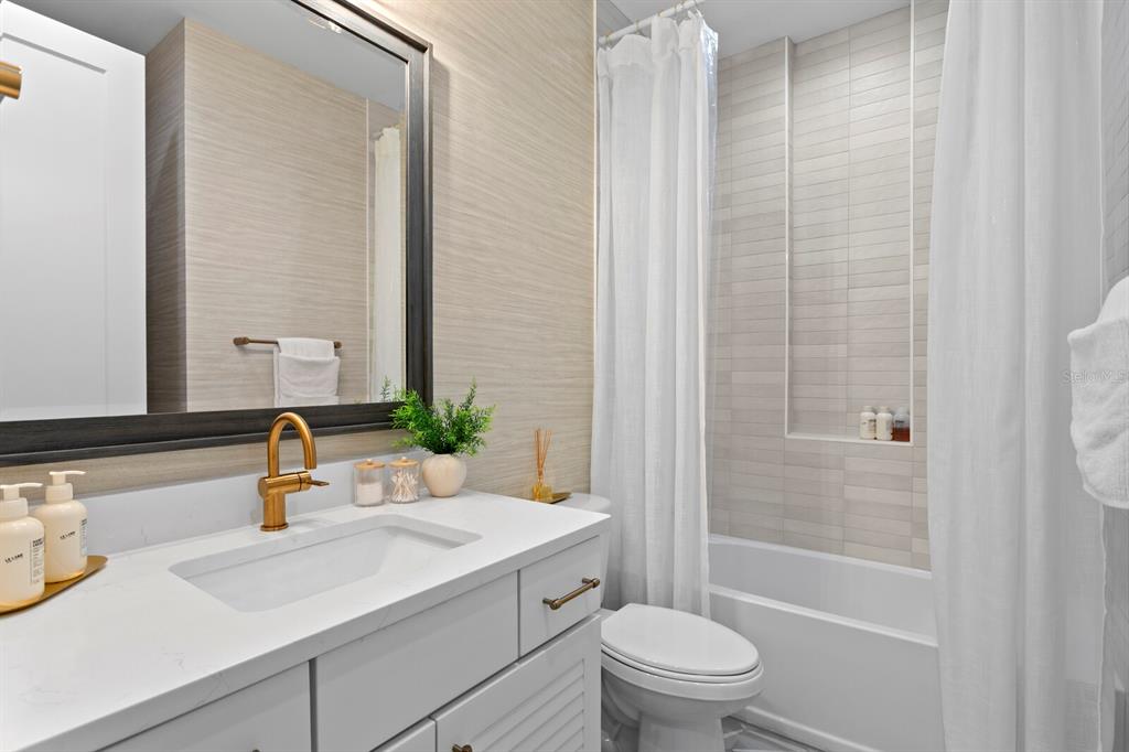 4807 West San Rafael Street Tampa, FL 33629 - Photo 32 of 64 a bathroom with a sink a toilet and shower