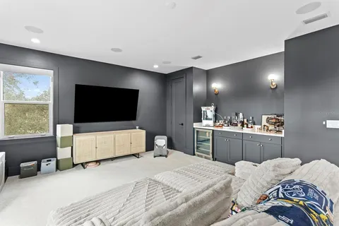 a bathroom with double vanity sinks a mirror and a shower