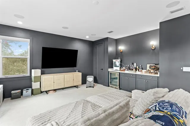 a bathroom with double vanity sinks a mirror and a shower