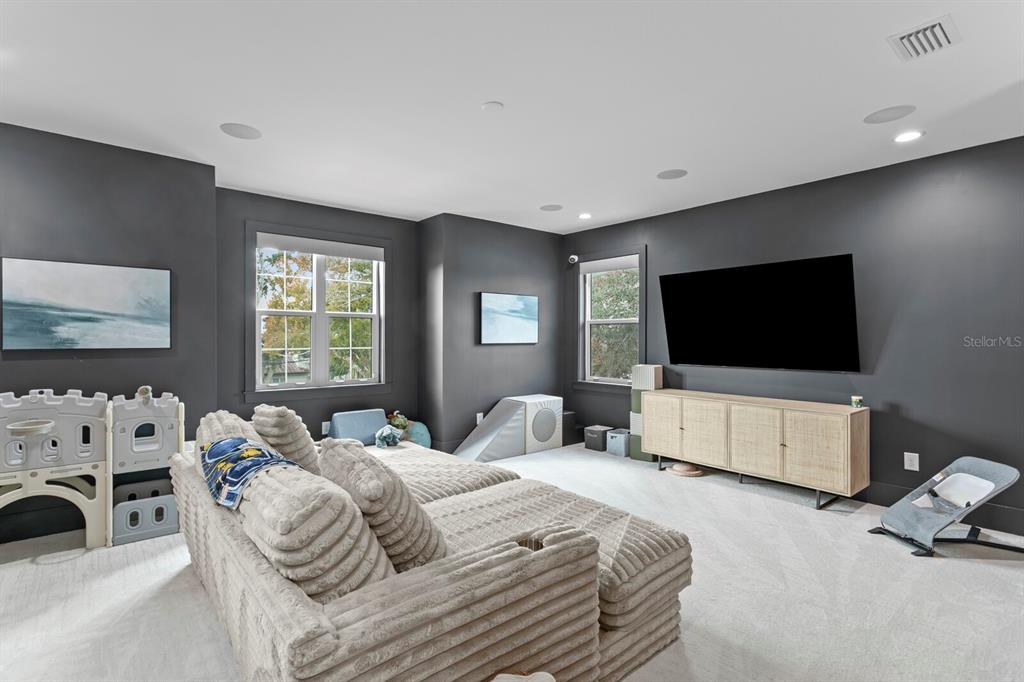 4807 West San Rafael Street Tampa, FL 33629 - Photo 35 of 64 a bedroom with a bed and a flat screen tv