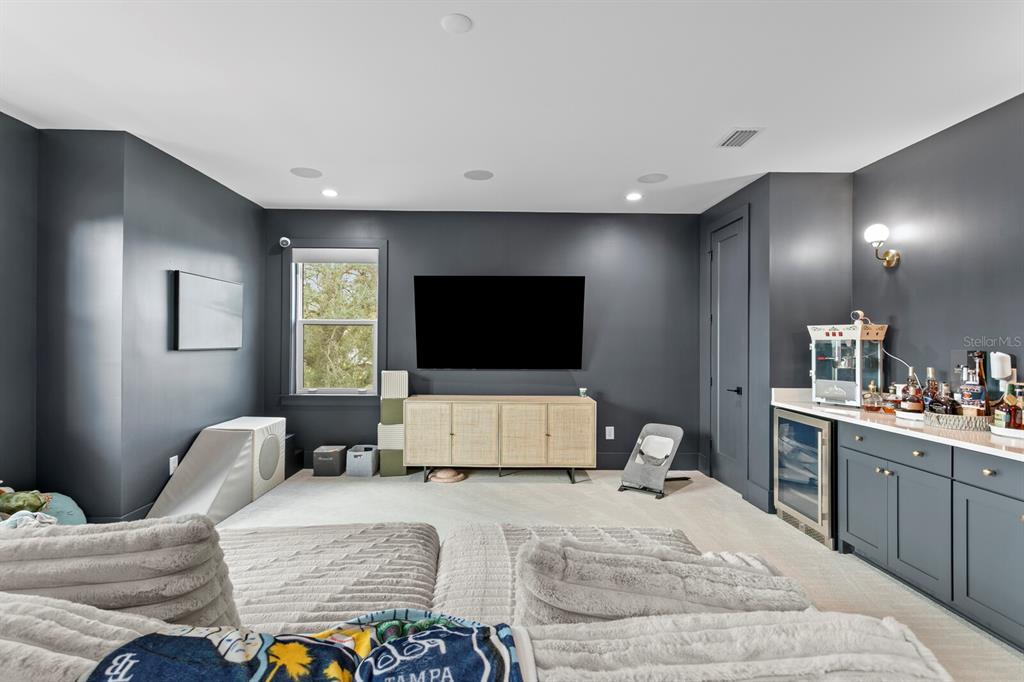 4807 West San Rafael Street Tampa, FL 33629 - Photo 36 of 64 a bedroom with a bed and a flat screen tv