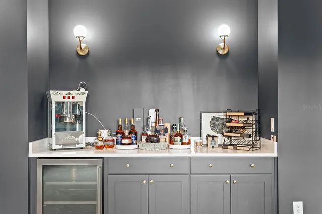 a utility room with cabinets washer and dryer