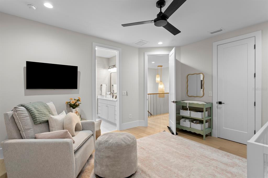 4807 West San Rafael Street Tampa, FL 33629 - Photo 39 of 64 a living room with furniture and a flat screen tv