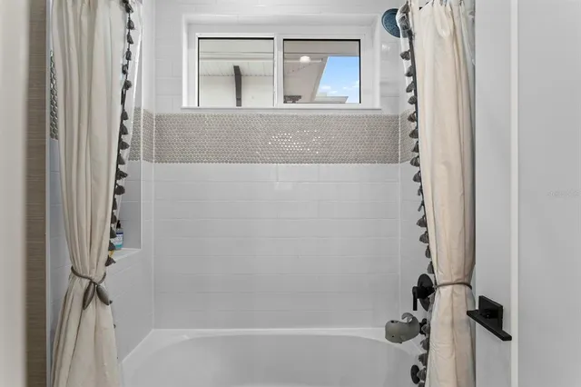 a living room with furniture fireplace and flat screen tv