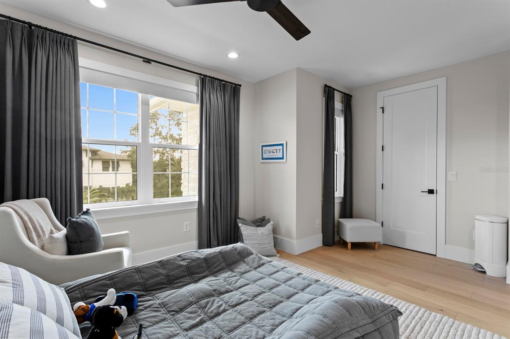 4807 West San Rafael Street Tampa, FL 33629 - Photo 43 of 64 a bedroom with a bed couch and window