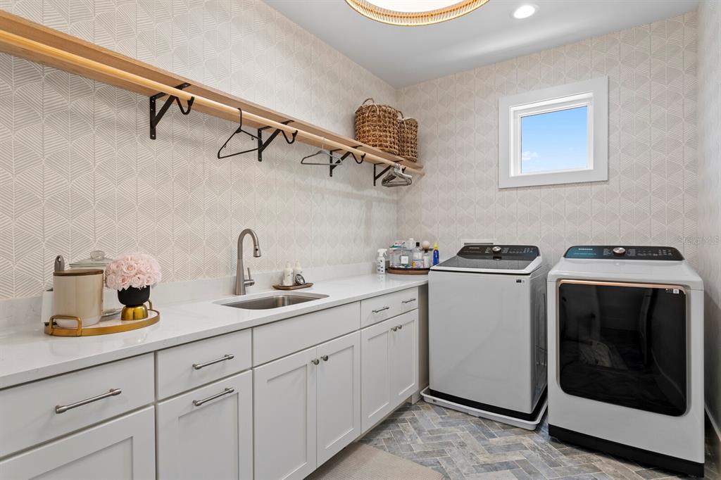 4807 West San Rafael Street Tampa, FL 33629 - Photo 47 of 64 a utility room with cabinets washer and dryer