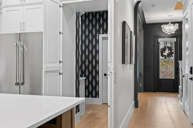 a kitchen with stainless steel appliances granite countertop a sink and cabinets