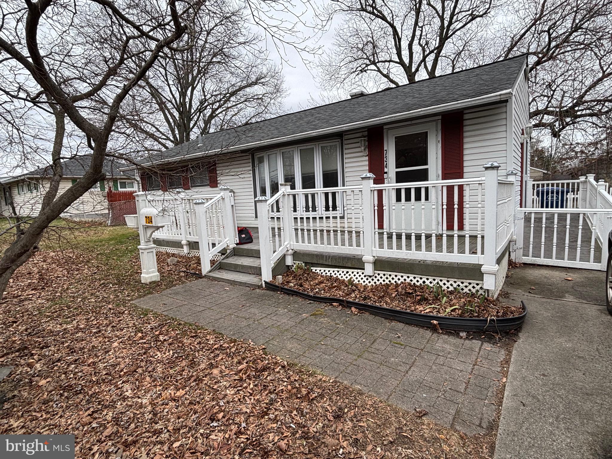 734 Main Street Lumberton, NJ 08048 - Photo 7 of 13 a view of a house with a yard and wooden fence