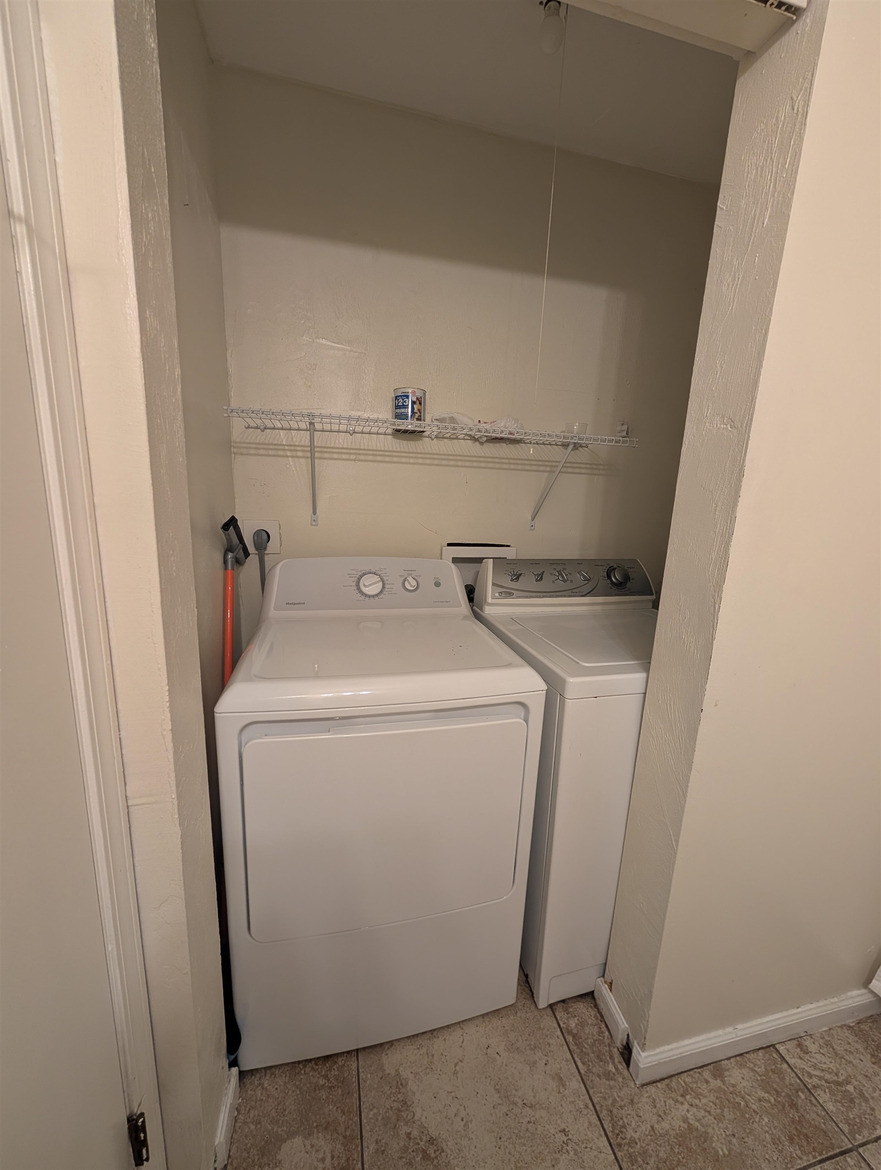 3885 Osprey Circle, Unit D St. Augustine, FL 32086 - Photo 2 of 12 Washroom with light tile patterned flooring and independent washer and dryer