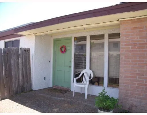 a backyard of a house with seating space