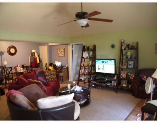 77 South Commonsway Drive Portland, TX 78374 - Photo 2 of 4 a living room with furniture and a flat screen tv