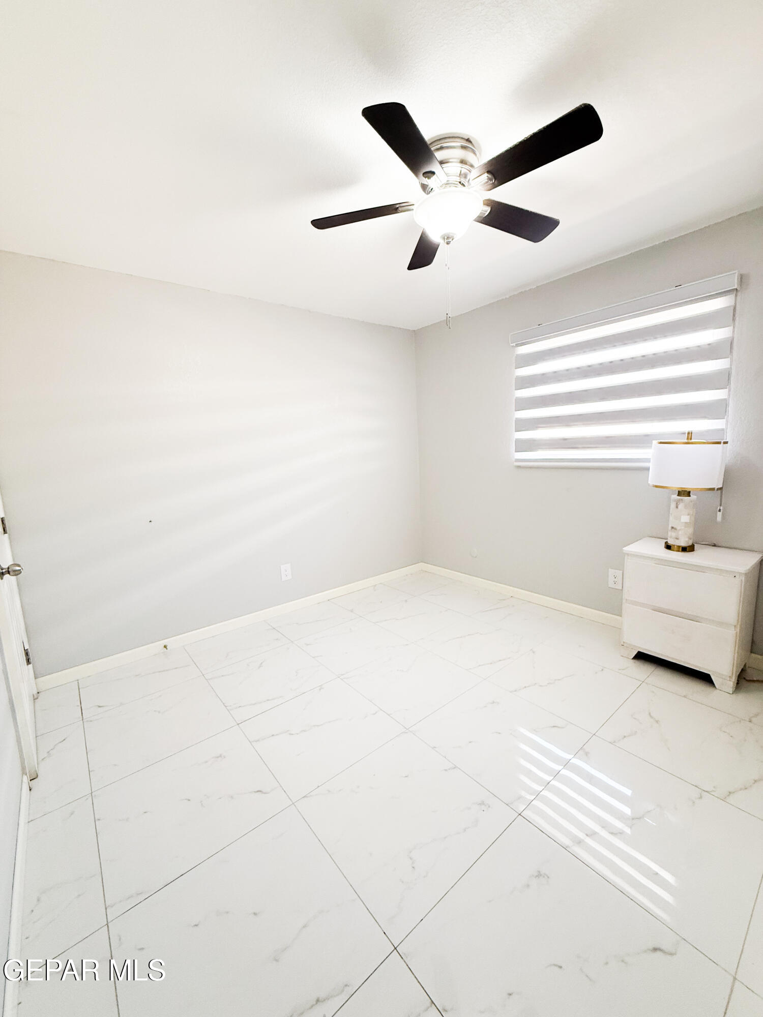 3112 Eads Place El Paso, TX 79935 - Photo 11 of 24 a view of a livingroom with a ceiling fan and window