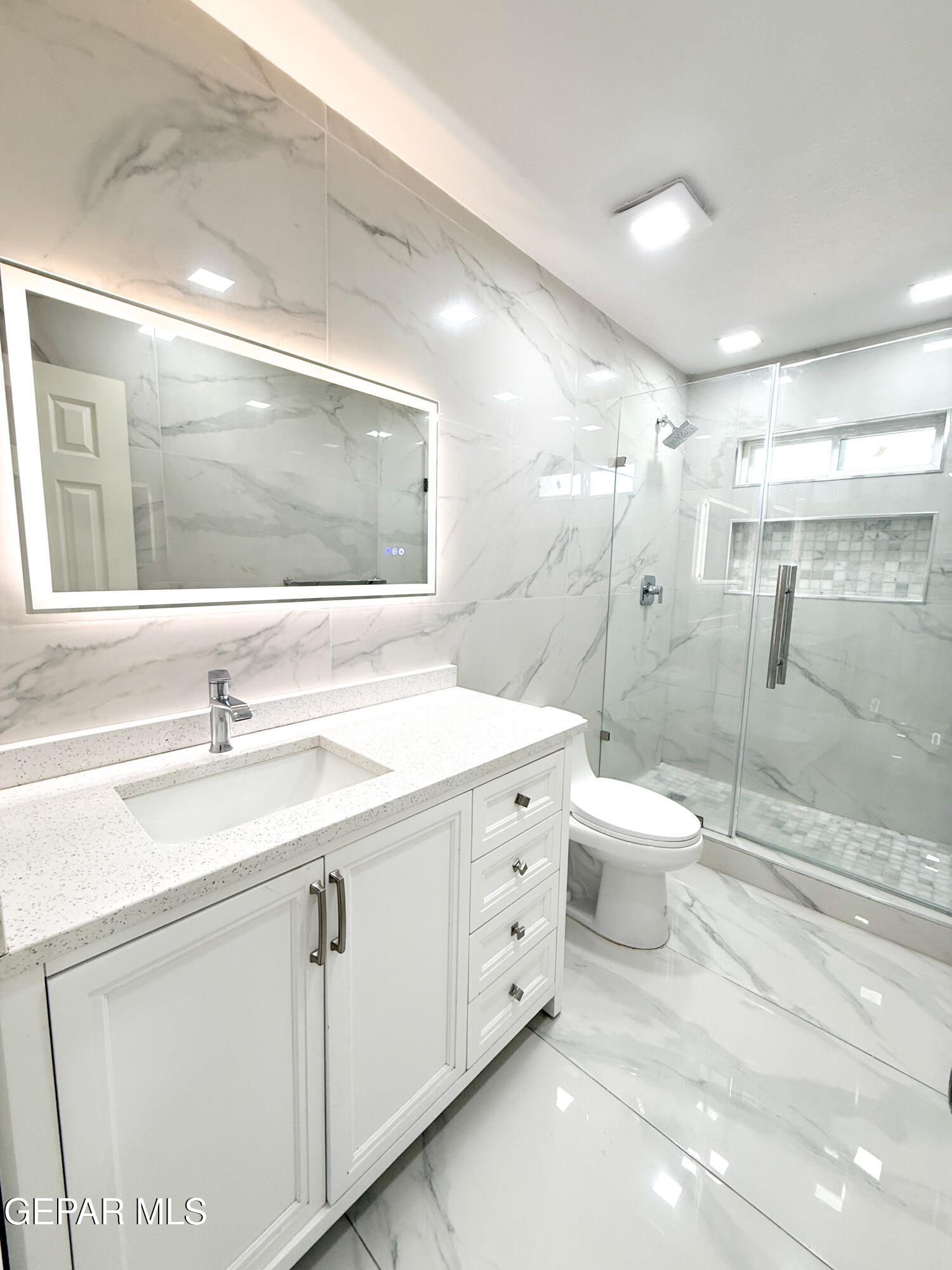 3112 Eads Place El Paso, TX 79935 - Photo 13 of 24 a bathroom with a double vanity sink toilet and shower