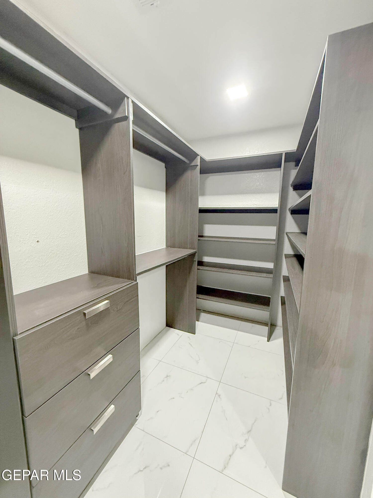 3112 Eads Place El Paso, TX 79935 - Photo 19 of 24 a view of walk in closet with empty racks