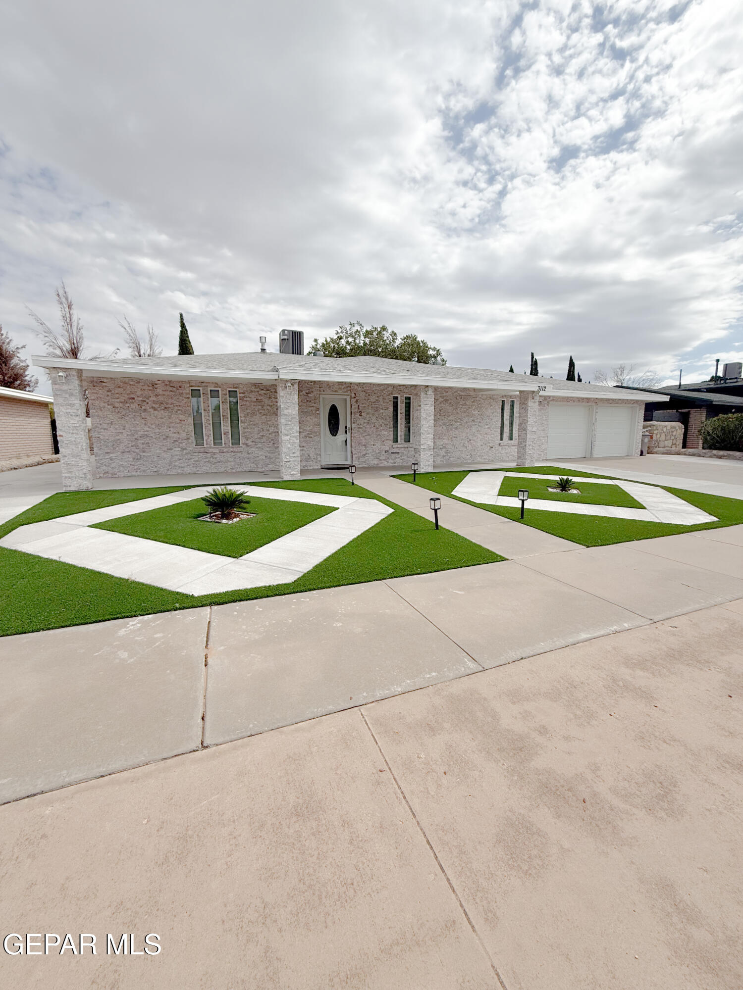3112 Eads Place El Paso, TX 79935 - Photo 2 of 24 a swimming pool with outdoor seating and house in the background