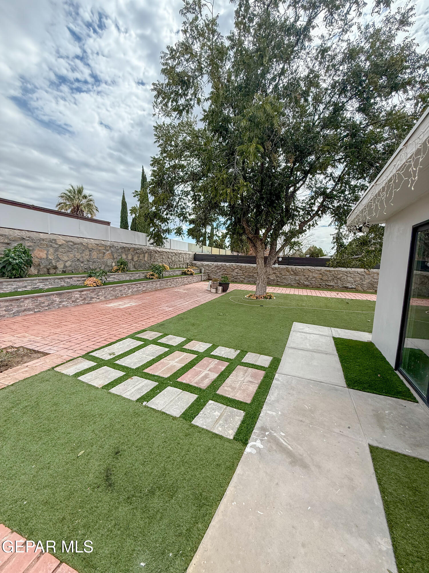 3112 Eads Place El Paso, TX 79935 - Photo 21 of 24 a view of yard with swimming pool and green space