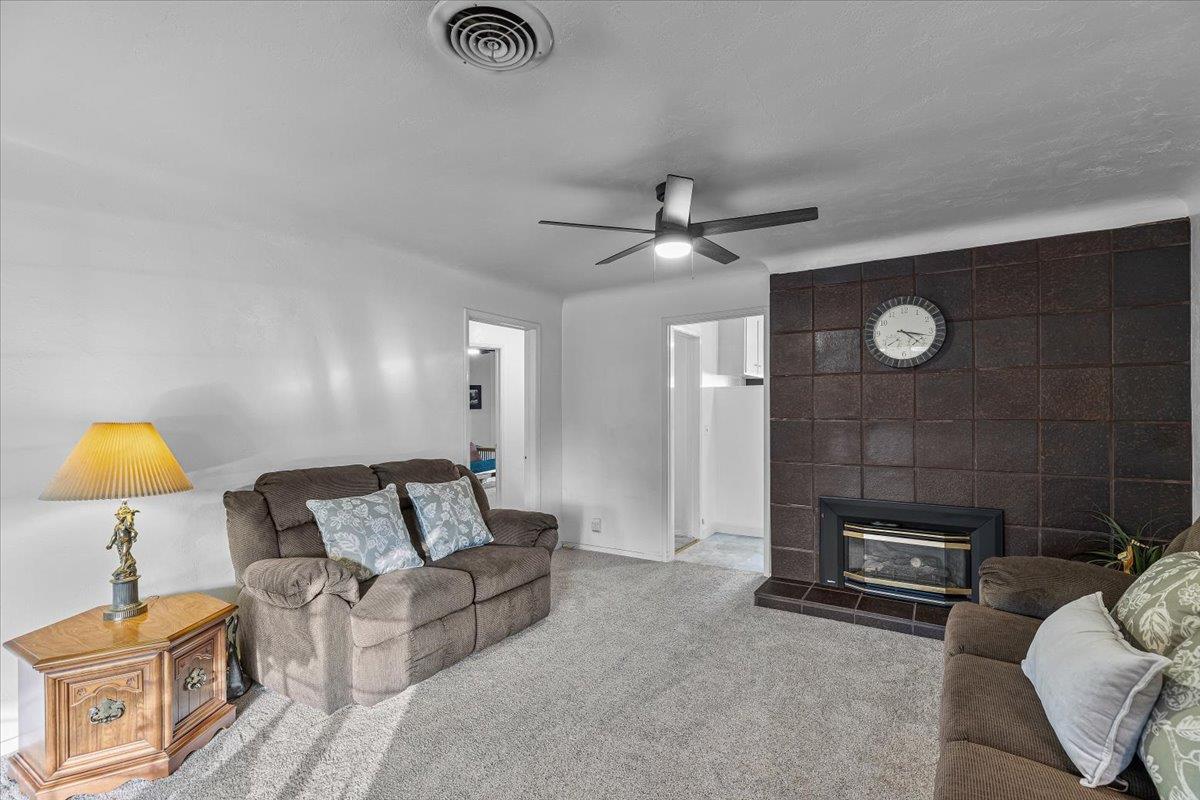 232 Fusco Avenue Modesto, CA 95354 - Photo 11 of 52 a living room with furniture and a lamp