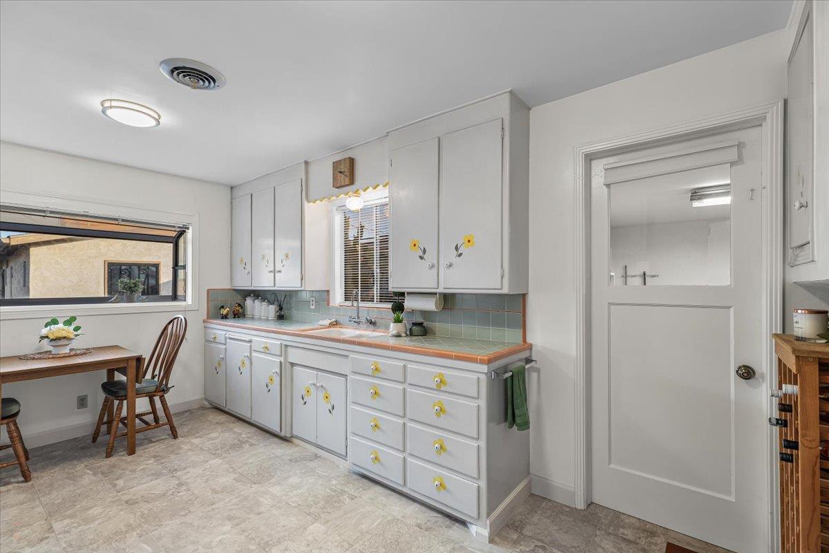 232 Fusco Avenue Modesto, CA 95354 - Photo 13 of 52 a view with a double vanity sink mirror and a window