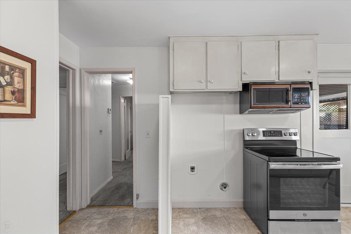 232 Fusco Avenue Modesto, CA 95354 - Photo 18 of 52 a kitchen with cabinets and stainless steel appliances