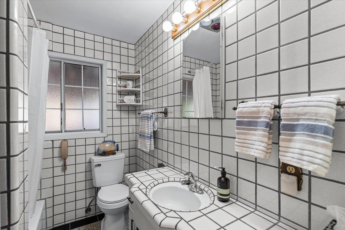 232 Fusco Avenue Modesto, CA 95354 - Photo 22 of 52 a bathroom with a toilet and shower