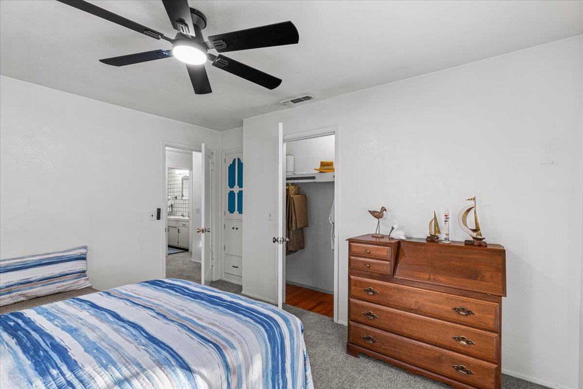 232 Fusco Avenue Modesto, CA 95354 - Photo 25 of 52 a bedroom with a bed and a ceiling fan