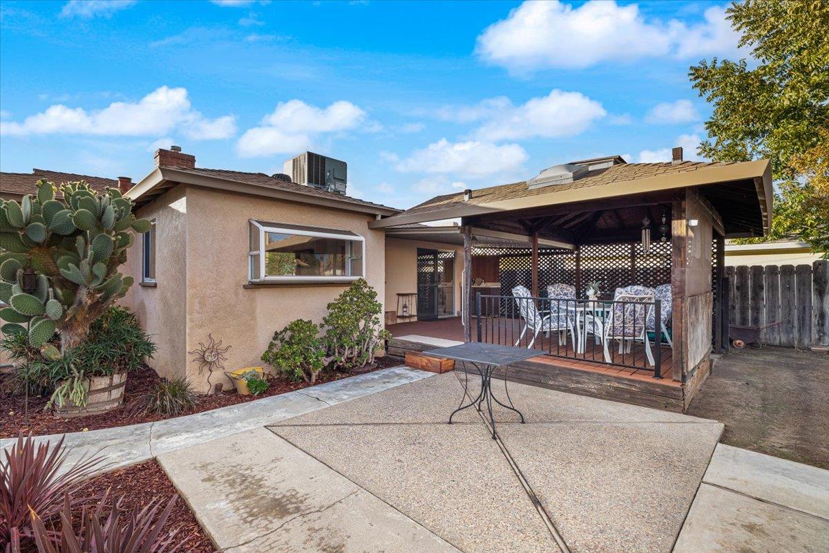 232 Fusco Avenue Modesto, CA 95354 - Photo 35 of 52 a wooden bench sitting in front of a house
