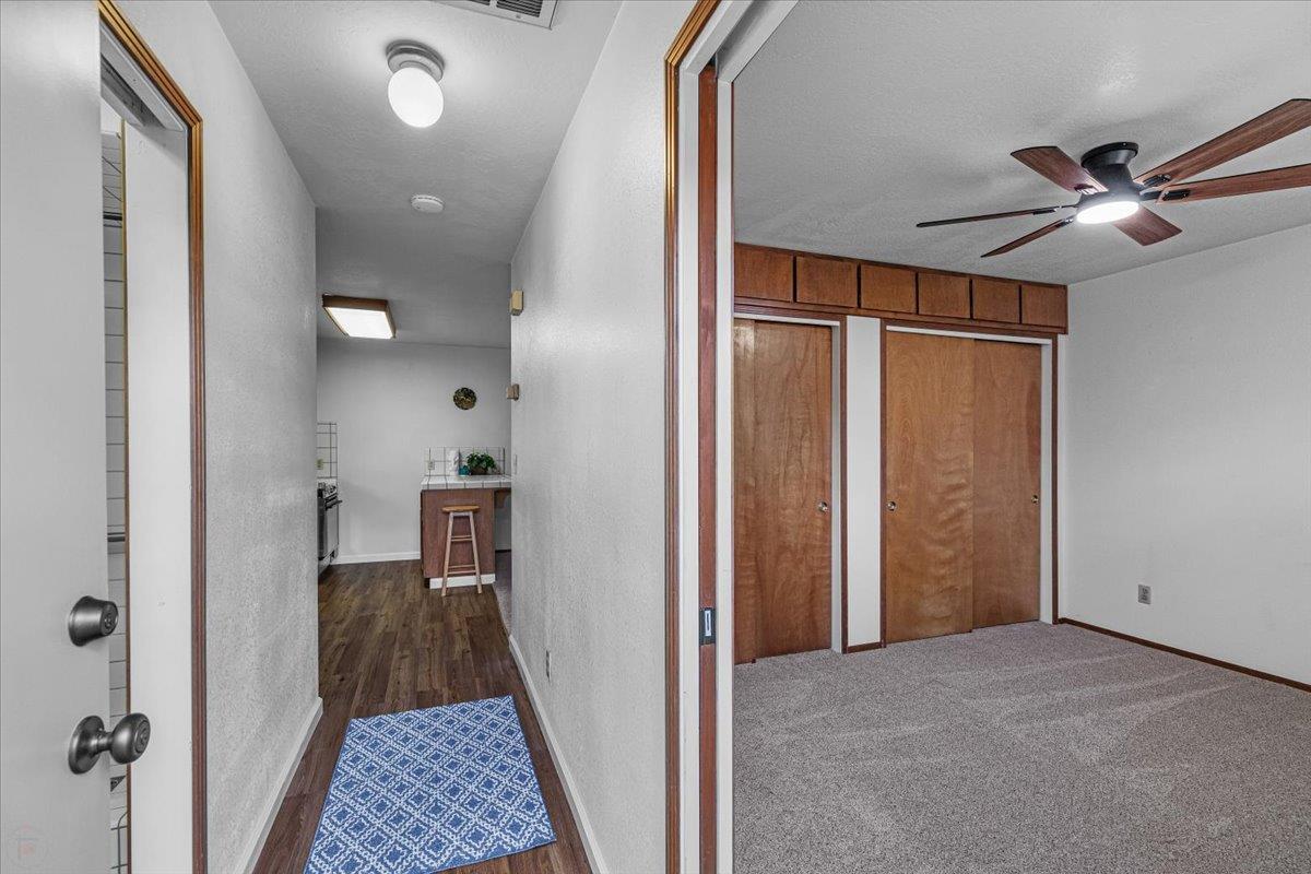 232 Fusco Avenue Modesto, CA 95354 - Photo 36 of 52 a view of hallway with wooden floor