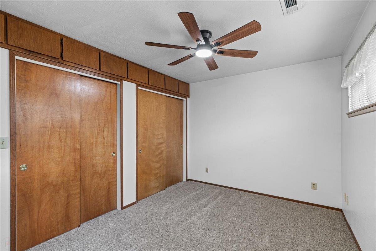 232 Fusco Avenue Modesto, CA 95354 - Photo 37 of 52 a view of a hallway with a ceiling fan