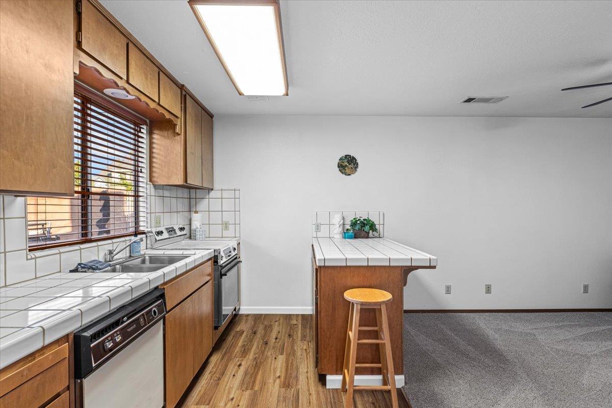 232 Fusco Avenue Modesto, CA 95354 - Photo 40 of 52 a kitchen that has a sink and a stove