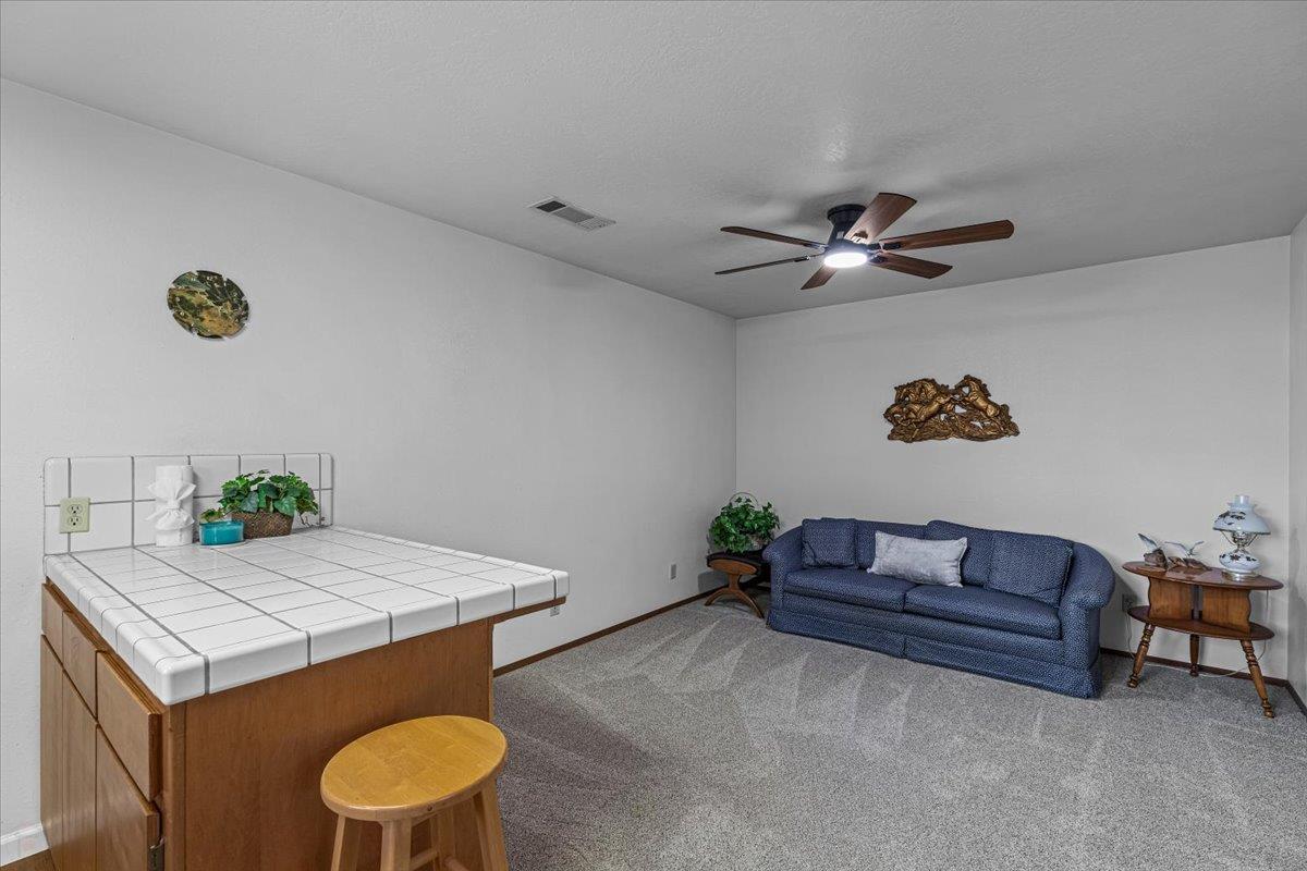 232 Fusco Avenue Modesto, CA 95354 - Photo 43 of 52 a living room with furniture and a table